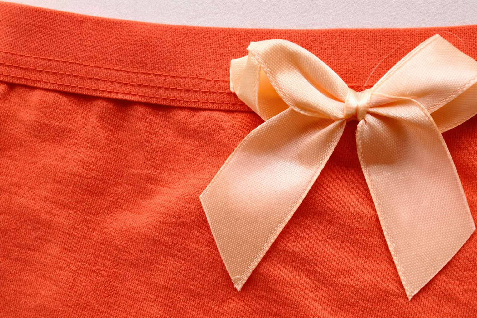 شورت نخی پادار کش پهن ساده رنگ نارنجی زنانه برند الماس نمای نزدیک